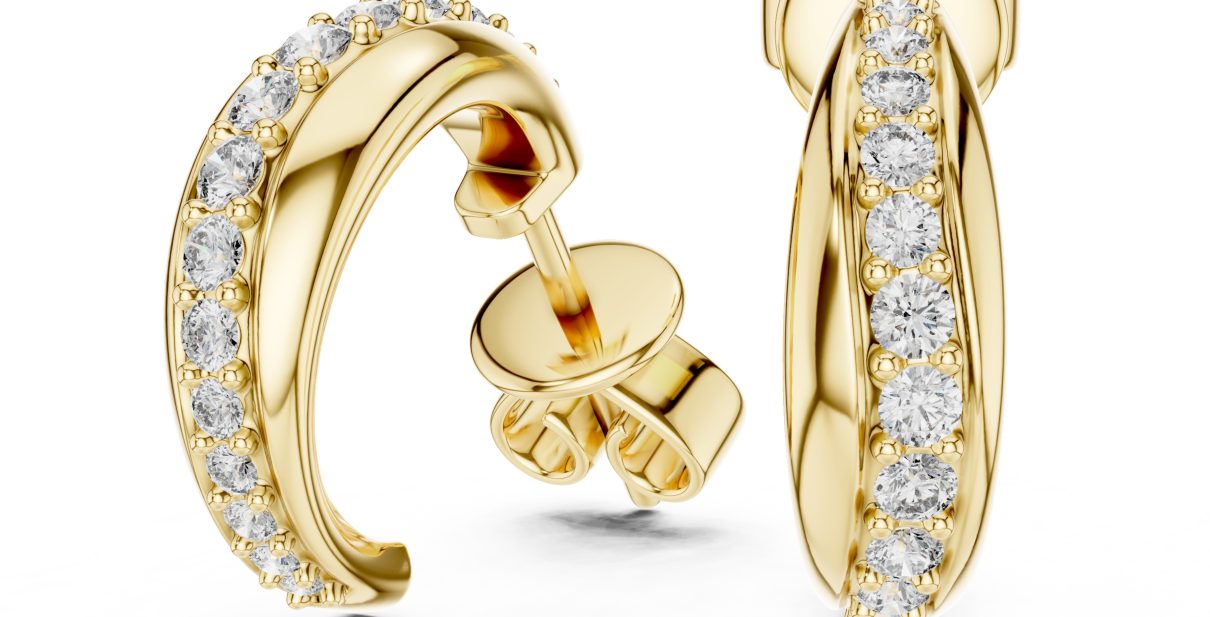 Elegant gold diamond hoop earrings with a smooth curved design and finely set stones for a clean, refined look
